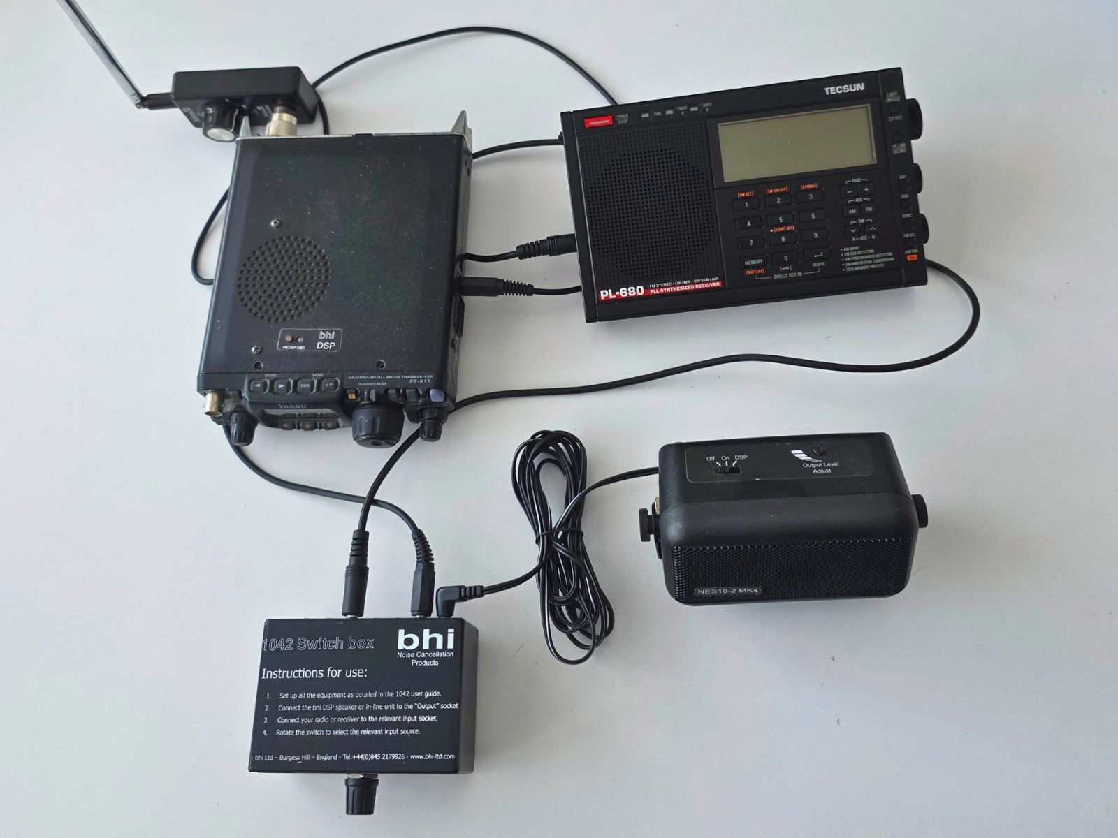 1042 switch box connected to two radios and an nes10-2 speaker