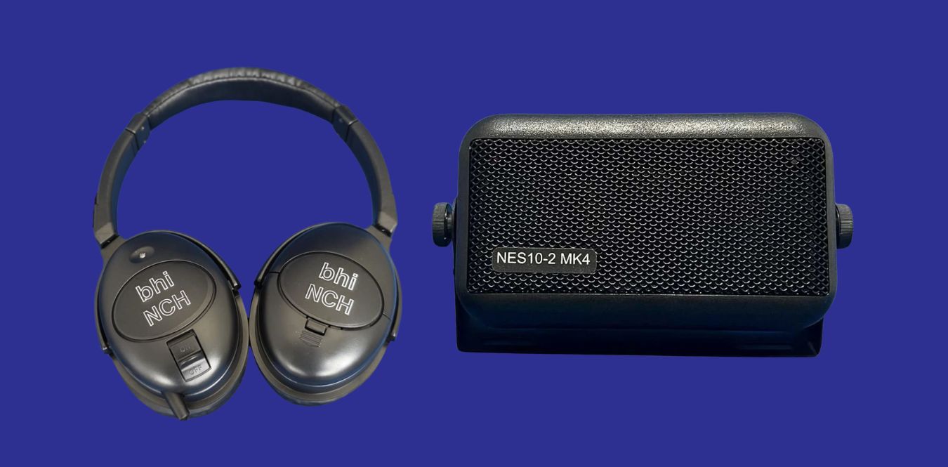 headphones and nes10-2 speaker on a blue background