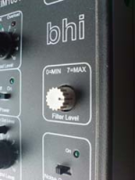 Grey rotary knob on a speaker